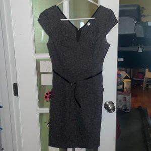 Charcoal shift dress with belt and pockets.